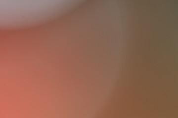 Abstract blurred background with gradient shades of red and light tones