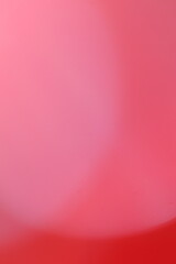 Abstract red and pink gradient background with soft blurred edges