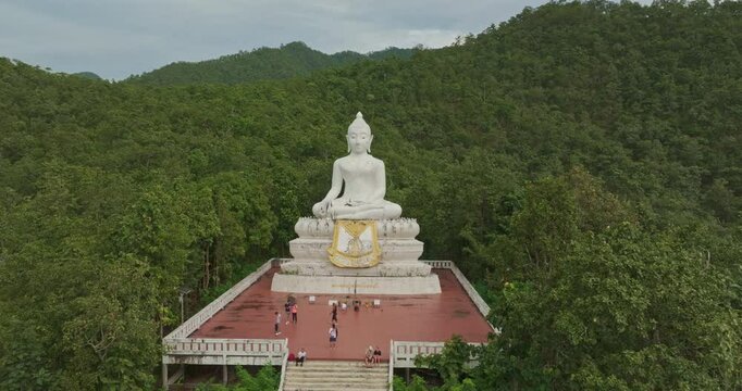 Aerial view Wat Phra That Mae Yen, an ancient temple that has been a symbol of Pai for a long time. Phra Phuttha Lokuttara Mahamuni, a large white Buddha statue in the Mara-Vijaya attitude on hilltop