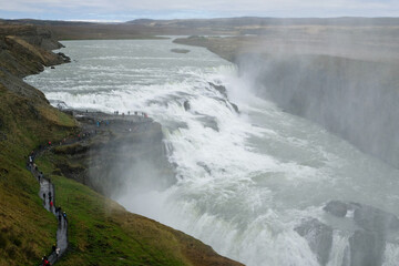 Majestic Gullfoss Waterfall in Iceland, Showcasing Immense Power and Beauty as Water Plunges into a Deep Canyon