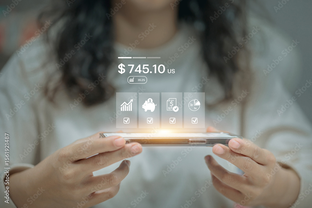 Poster a person holds a smartphone displaying a financial app interface with savings data and investment ic