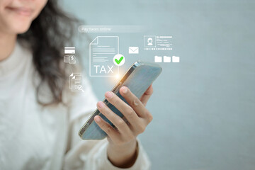 A woman uses her smartphone to pay taxes online, with digital icons for tax forms, payment, and ID...