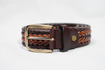 Coiled, rustic two-tone braided leather belt in brown and tan with a vintage-look brass buckle.