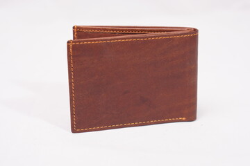 Open light brown leather wallet with a smooth finish and contrasting stitching, blending elegance...