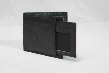 Open black textured leather wallet with a convenient pull-out ID window, offering both style and...