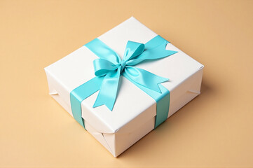 A white gift box with a blue ribbon tied around it.