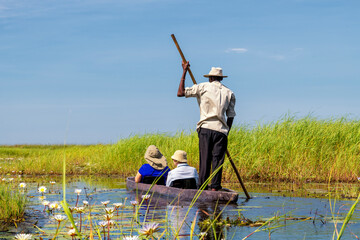 On the way in a dugout canoe through the Okavango Delta, Botswana
