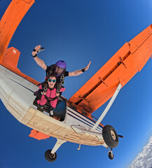 Jumping out of the orange plane with lots of adrenaline