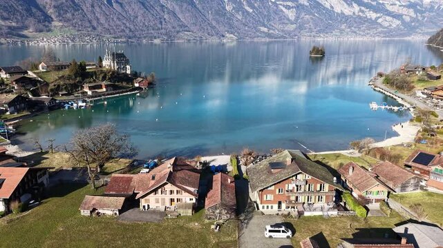 Drone view at the village of Iseltwald on lake Brienz in the swiss alps