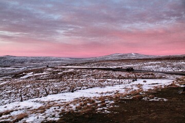 Sunset in hills in Northumberland, UK, winter