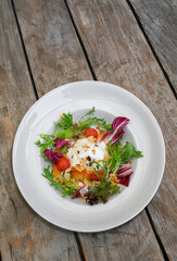 Marinated peaches with burrata, fresh salad bouquet and roasted almonds