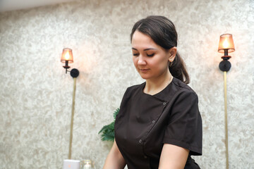 Portrait of a pretty young beauty salon worker work clothes.