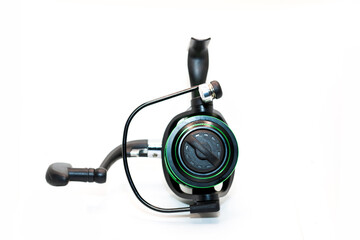 Green fishing reel with fishing line isolated on white background, ideal outdoor activities and sports. Photos from all angles and sides.