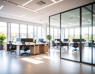 Modern office interior with spacious layout, large windows, and greenery, showcasing a productive work environment