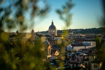 Golden hour sunset with beautiful warm cityscape of Rome, Italy. © vojta