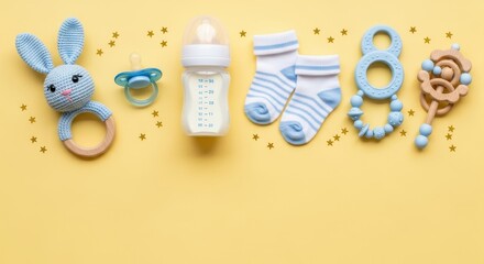 Baby shower invitation background with rattle, pacifier, socks and bottle on yellow