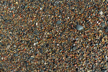 Closeup of round sea pebbles on beach. Suitable as natural background or texture for design,...