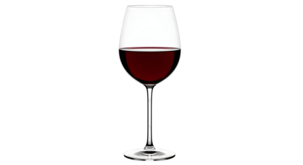 A single wine glass filled with red wine against a stark black background in a studio setting