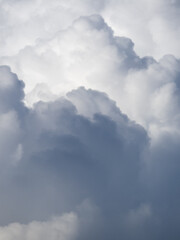 Fluffy, clouds gather in the sky, creating a moody atmosphere.