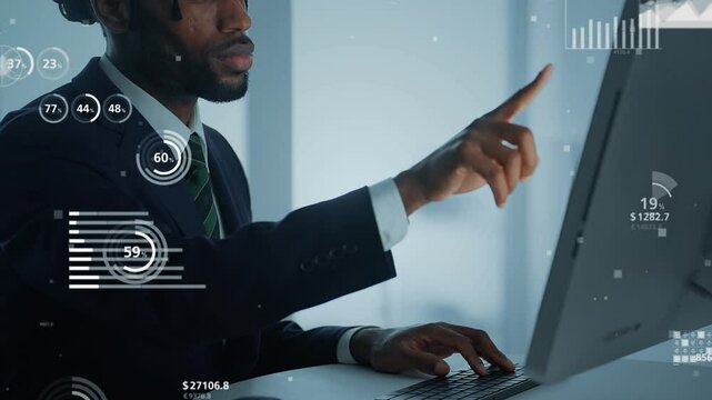 Black man working on a computer and statistical data concept