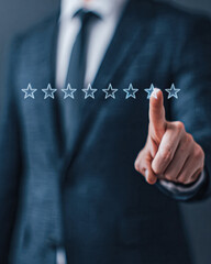 A businessman in a suit is giving a one-star rating by pointing at a row of outlined stars in a digital interface.