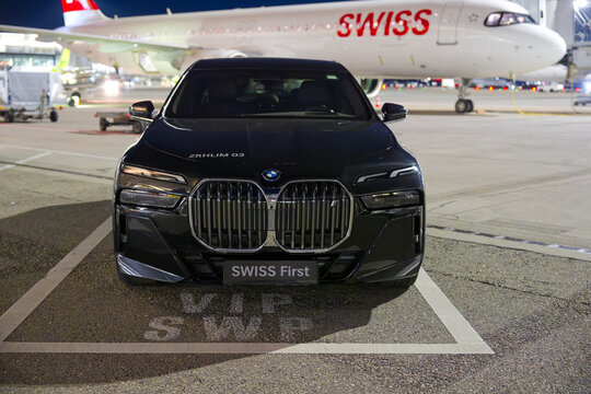 Front view of parked Swiss BMW i7 xDrive60 electric VIP limousine at Swiss Airport Z&uuml;rich Kloten at a spring night. Photo taken April 8th, 2025, Zurich Airport, Switzerland.