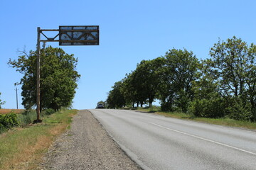A road with trees on the side