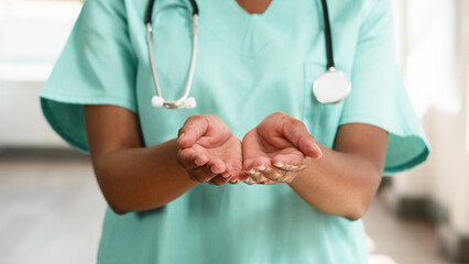 Compassionate Medial Professional Offering Care and Support Wearing Green Scrubs and Stethoscope