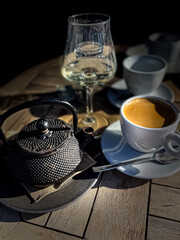 Tea pot, glass and cup of coffee 