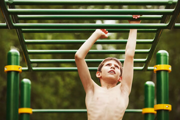 Teen exercise on the playground.