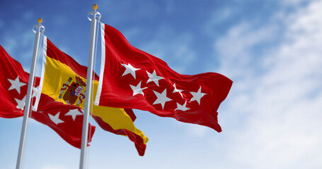 Detail of the Community of Madrid flag waving with national spanish flag