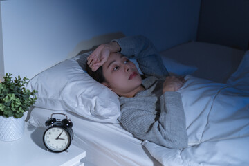 Annoyed, stressed, anxiety asian young woman suffering from insomnia, frustrated awake on bed at...
