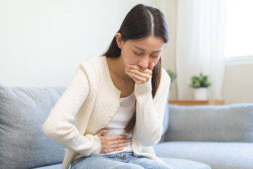 Unhappy pregnant asian young woman, pain girl suffering from nausea, having vomit feeling sick...