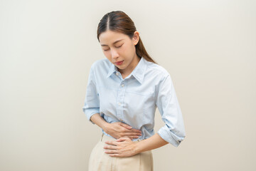 Flatulence asian young woman intolerance hand in stomach ache, suffer from food poisoning,...