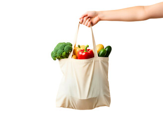 Hand holding a reusable green mesh bag filled with fresh vegetables