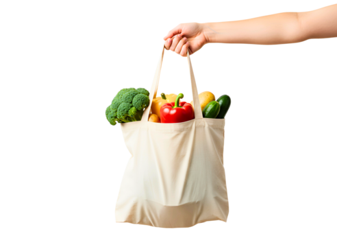 Hand holding a reusable green mesh bag filled with fresh vegetables