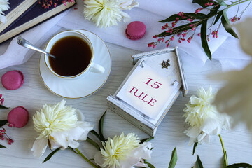 Calendar for June 15: number 15, name of the month June in English on a flip calendar among...