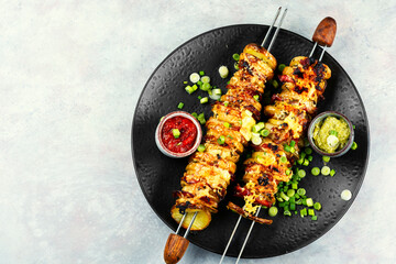 Delicious kebab of bacon and potatoes, recipe place.