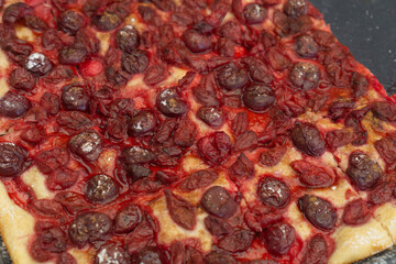 homemade pie with fresh cherries, concept of bakery, dessert, food description: a close-up shot of a rustic, homemade pie generously topped with a layer of dark red, fresh cherries