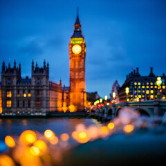 Iconic big ben and houses of parliament illuminated at dusk with bokeh lights