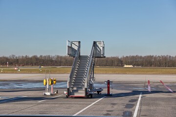 Airplane ground handling stairs standing unused, empty