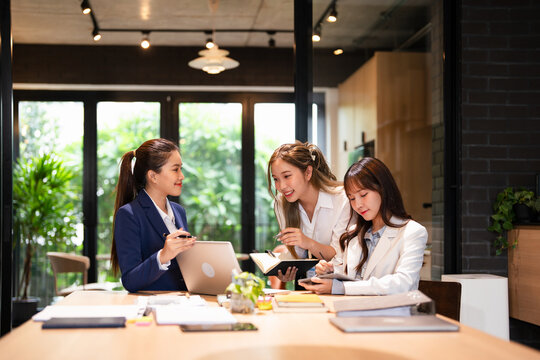 Business people, coach at office for internship program or training staff. Businessman, executive or mentor helping junior employee  woman with software for communication.