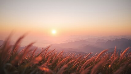 Naklejka premium Distant mountain ranges layered softly in pastel colors, highlighted by a warm golden sunset, with grasses in the foreground