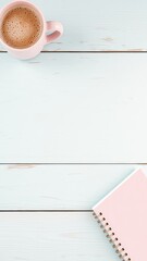 Planning on a pastel wooden surface with a notebook and a warm cup of coffee for cozy mornings