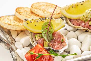 Raw Tuna tartar with avocado and sauce, Food recipe background. Close up. top view