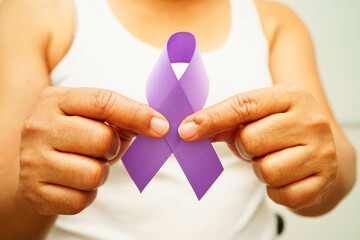 Asian woman with purple ribbon for September World pancreatic cancer day or world Alzheimer day.