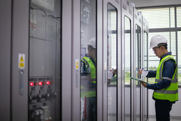 Engineer performs detailed inspection at substation to ensure protection systems and relay devices...