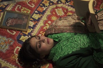 A Kashmiri model wearing a handcrafted green traditional jacket by Kaar Kash, showcasing timeless...