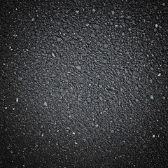 Asphalt texture background with dark gray tones and rough surface  