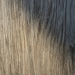 Textured wooden surface with varying shades of brown and grey  